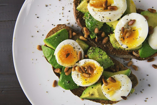 avocado toast topped with eggs rich with vitamins