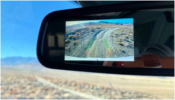How do 360-degree backup cameras improve parking safety?